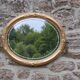 Miroir ovale vintage doré à décor floral et verre biseauté – 58 × 48 cm