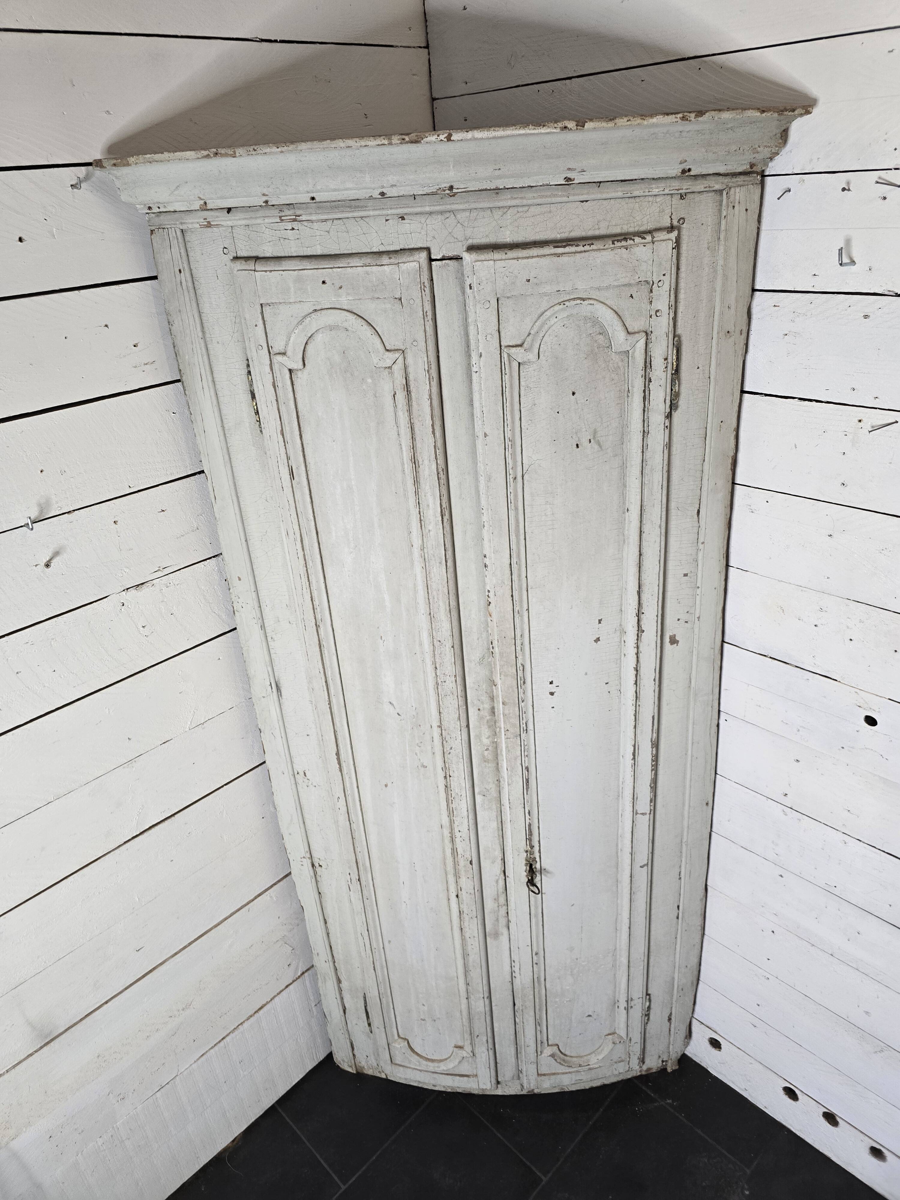 19th century curved corner cupboard in patinated oak
