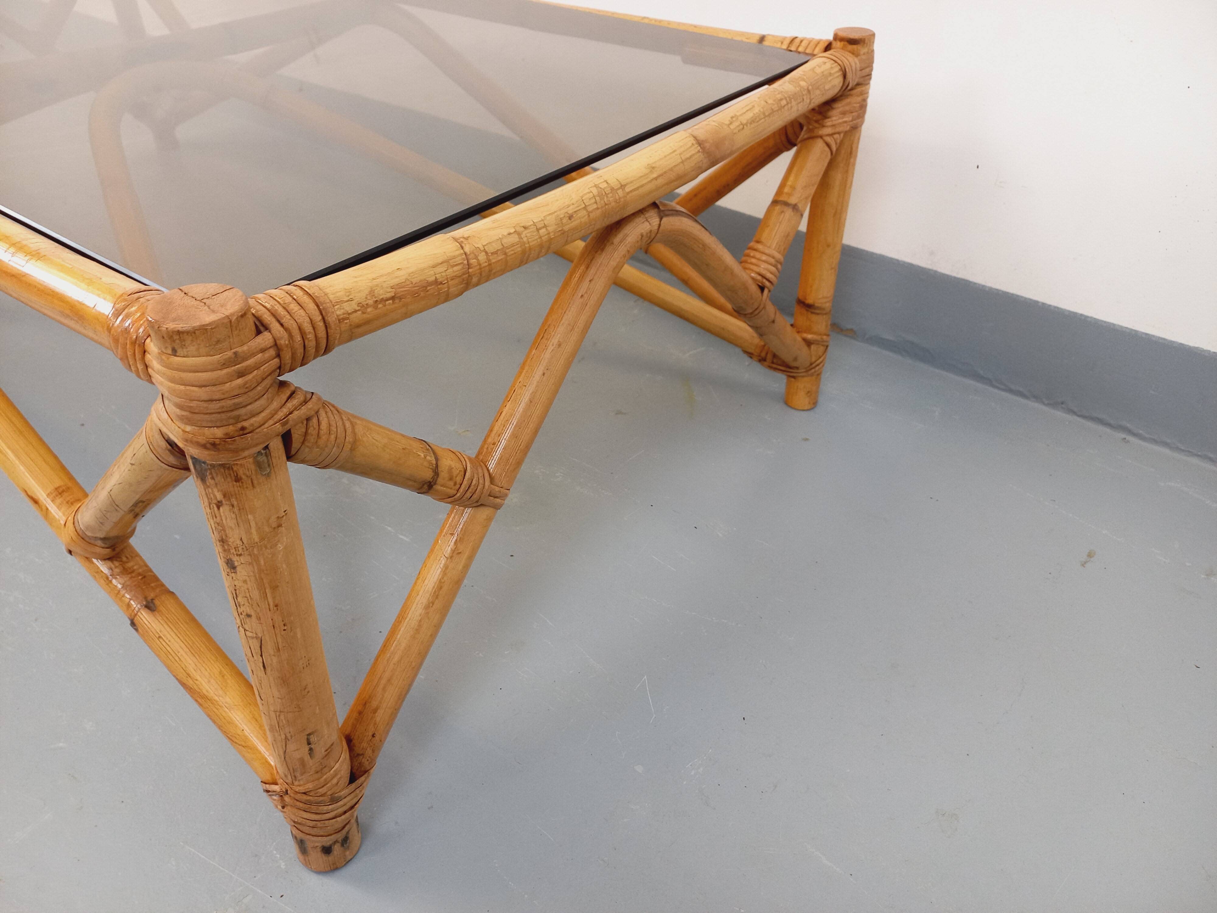 Vintage rectangular coffee table in rattan and smoked glass from the 1970s.