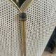 Metal umbrella stand with rigitulle and brass from the 1950s.