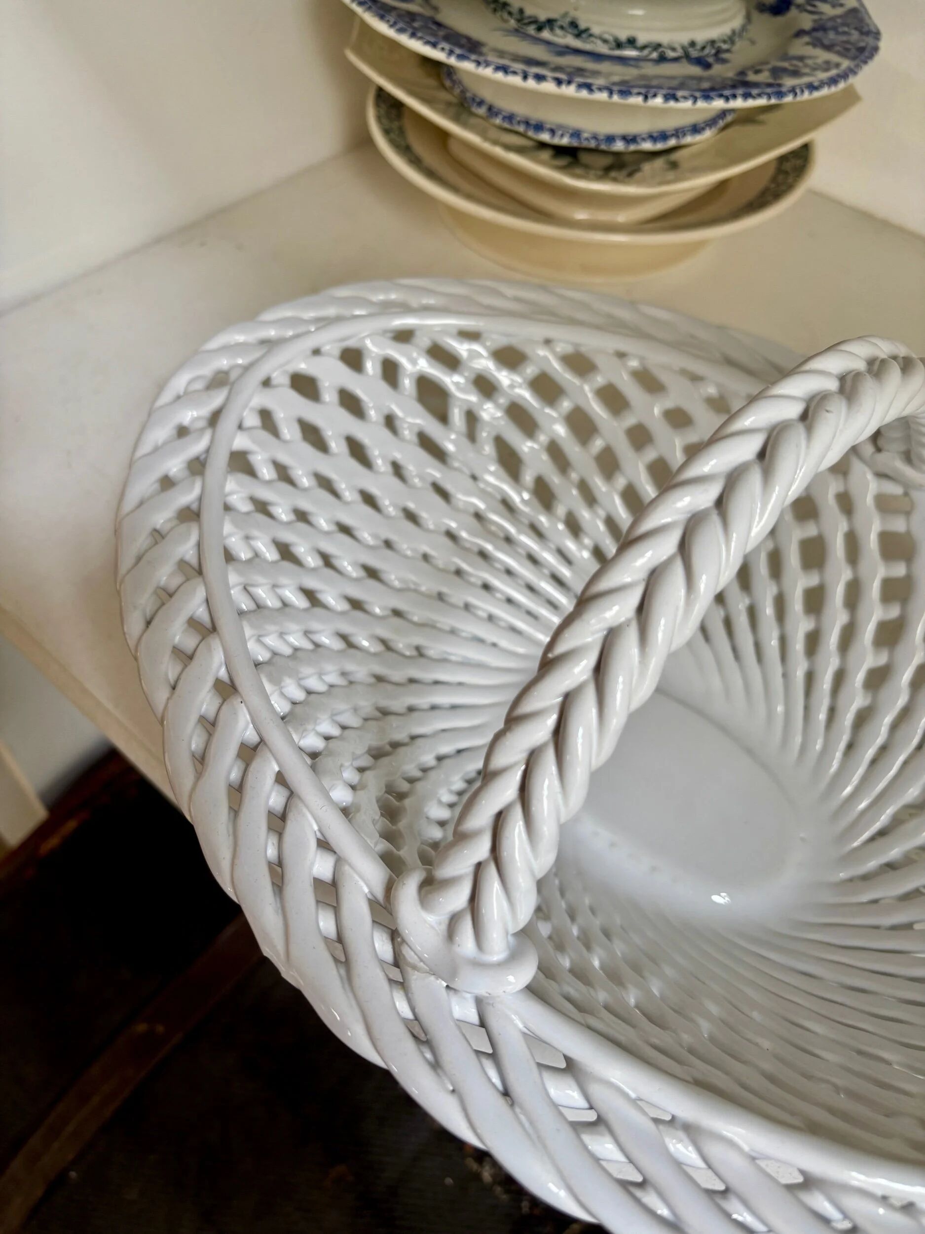 Oval basket in white glazed earthenware