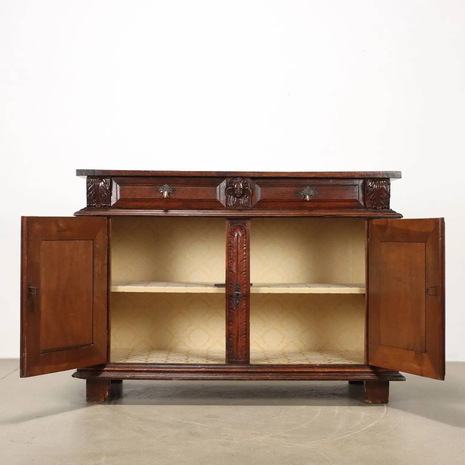 Ancient baroque walnut buffet with decorations, 18th century