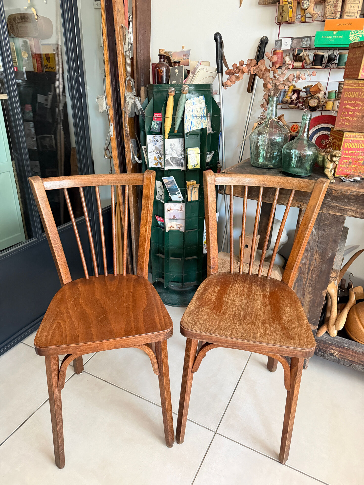 Pair of vintage Baumann bistro chairs in wood.