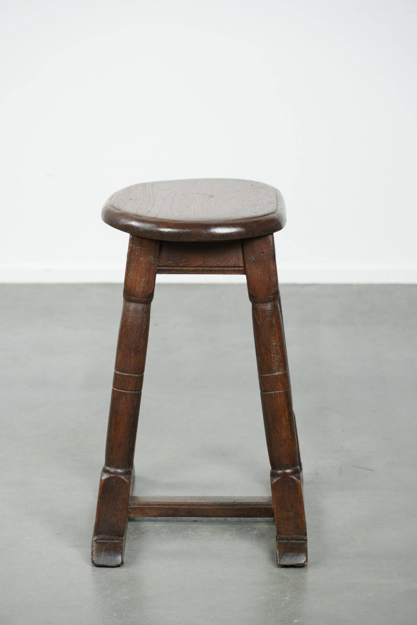 Antique Dutch oak stool from the early 19th century with a nice design
