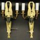Pair of winged putti wall sconces in Louis XVI style - gilded bronze and black patina