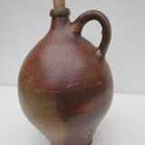 ancient water jug in vitrified sandstone, bulging avc handle