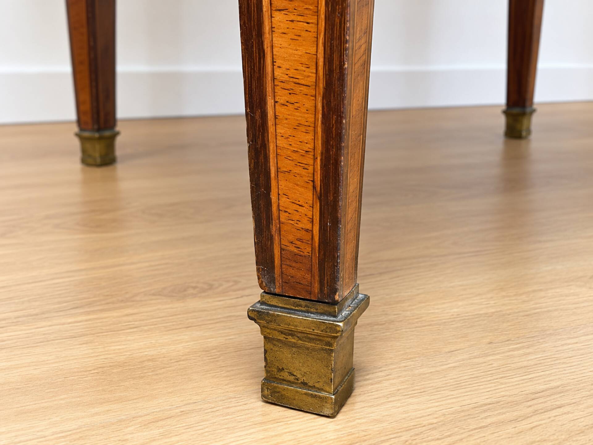 Bouillotte table in Louis XVI style with marquetry, marble, and brass.