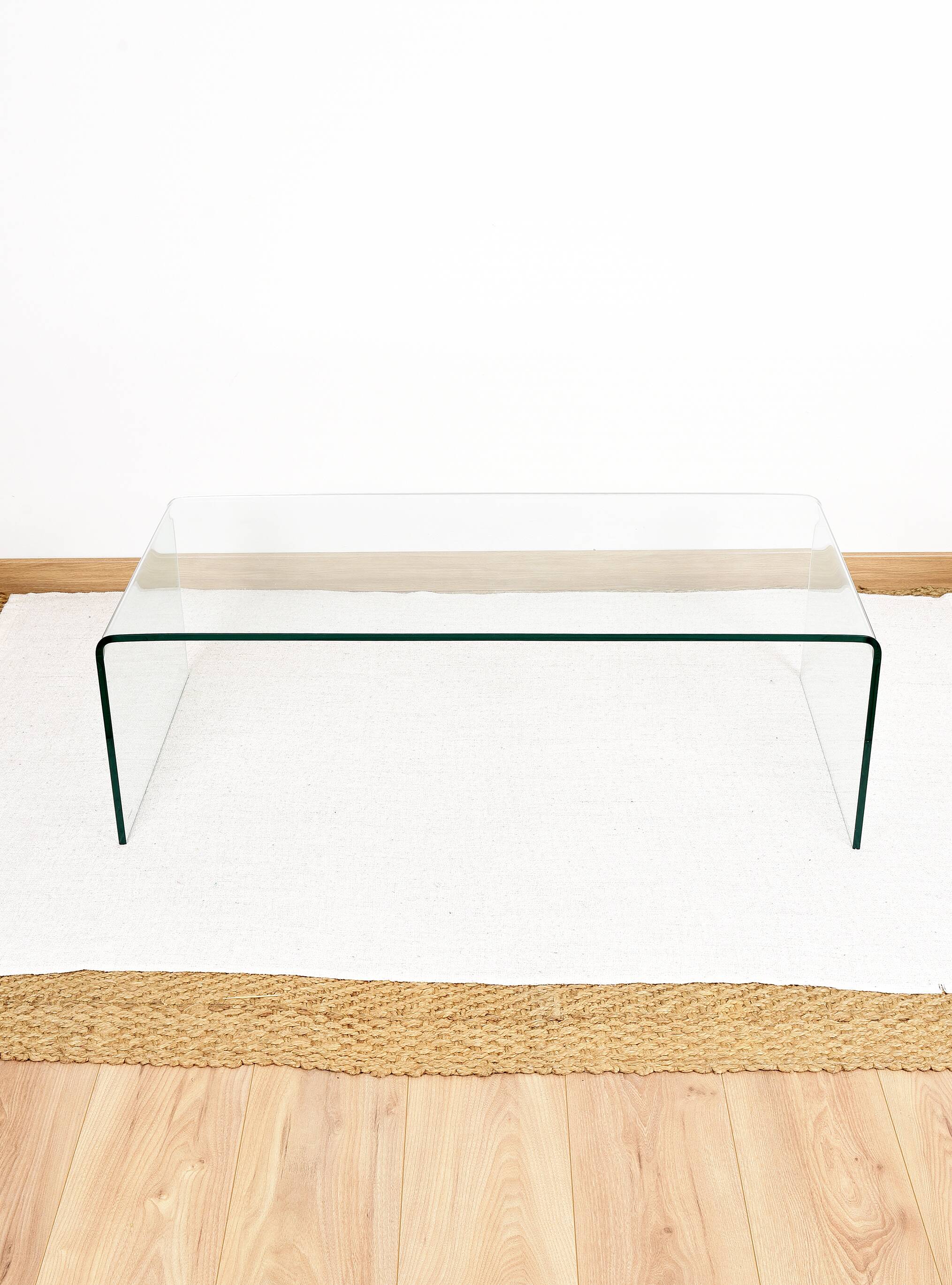 Transparent tempered glass coffee table.