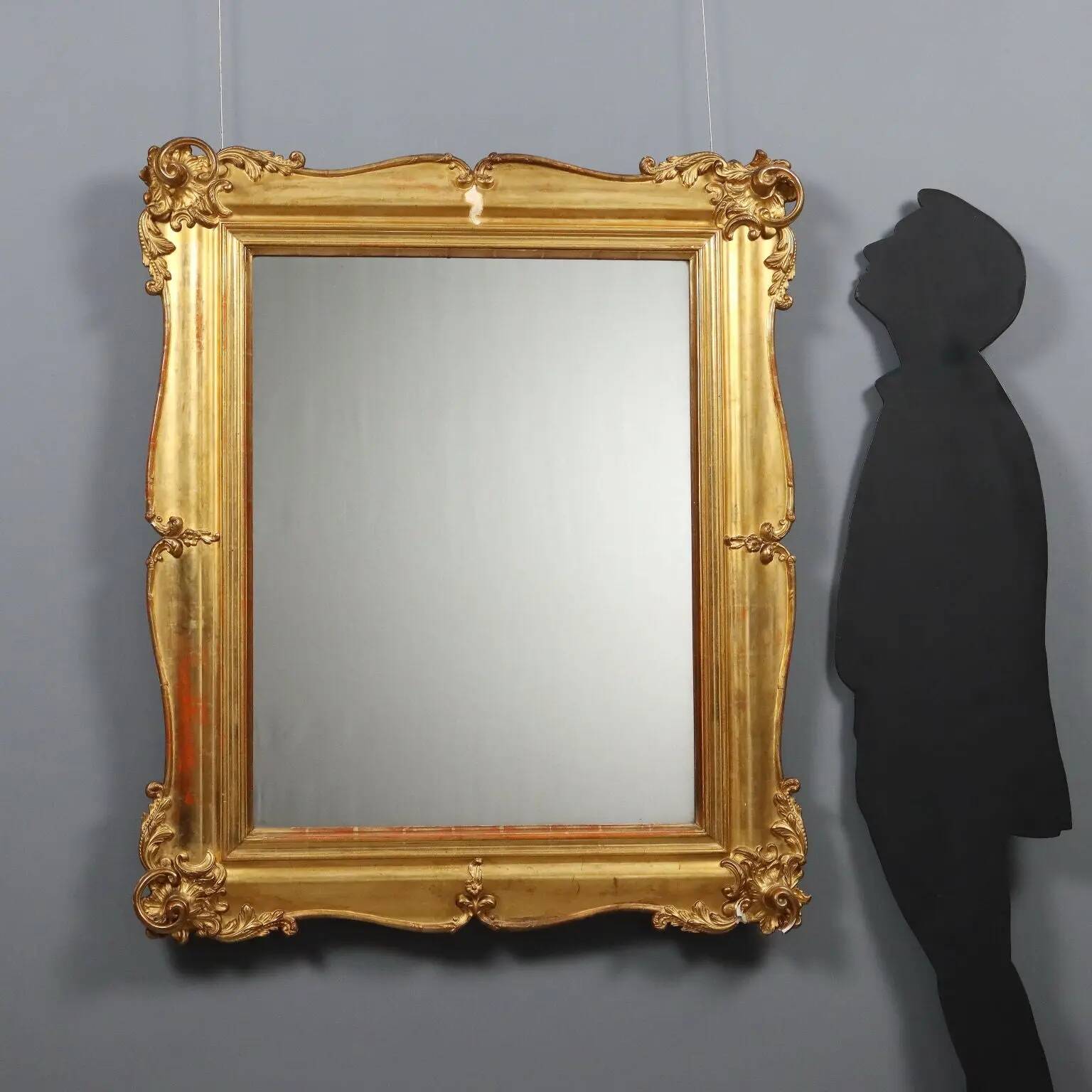 Antique carved and gilded wooden mirror, Italy, late 19th century.