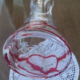 Glass decanter with red glass nets