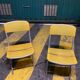 Yellow plastic and steel folding chairs, 1970s