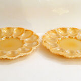Pair of iridescent orange glass egg plates
