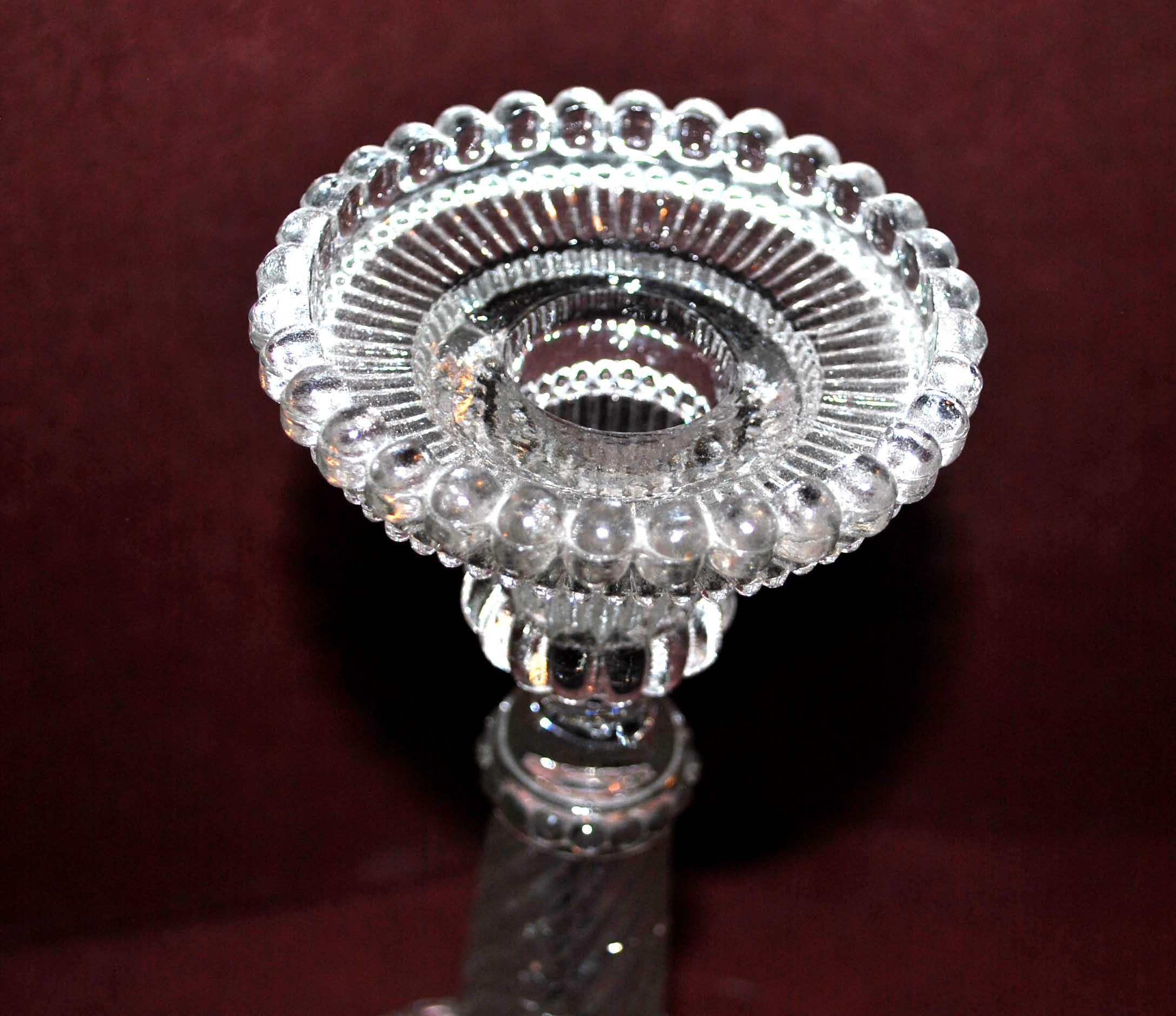 Old candlestick in molded glass of Portieux