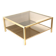 Large vintage Hollywood Regency coffee table made of brass and smoked glass from the 1970s