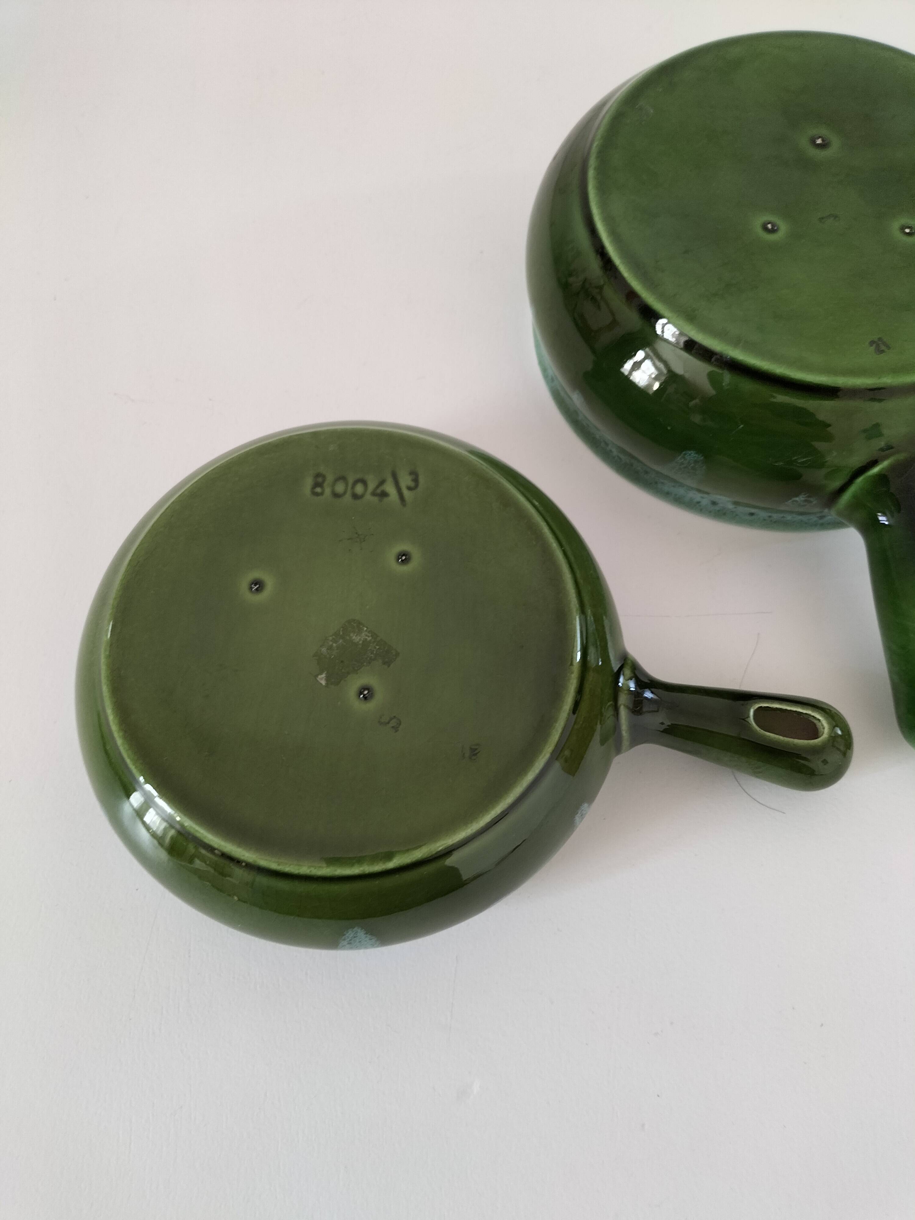 Duo of flowery caquelons