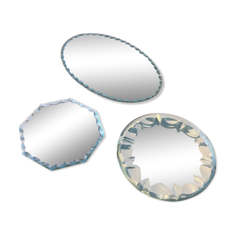 Set of 3 small beveled mirrors.