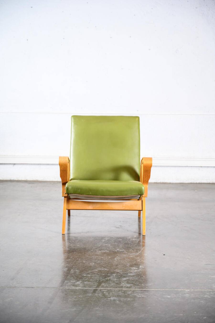 Fauteuil en skaï vert