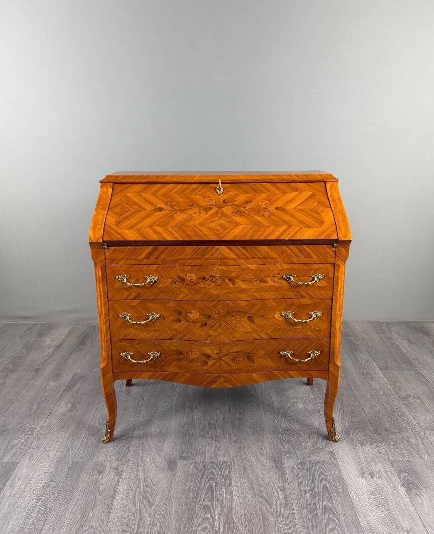 Louis XV style writing desk with a drop-leaf, made of veneer and marquetry, 19th century.