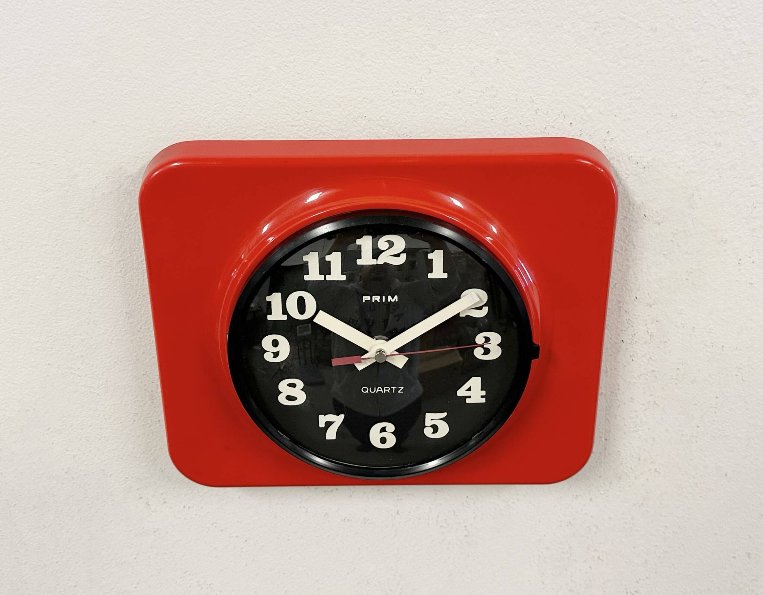 Vintage red bakelite wall clock from prim, 1970s