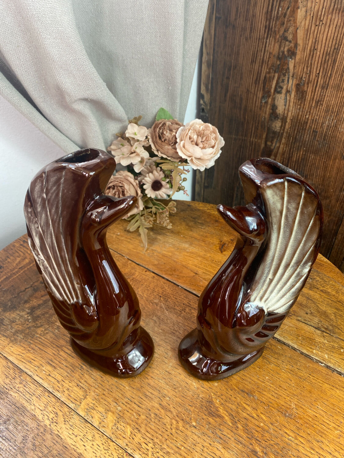 Pair of ceramic vases in the shape of swans.