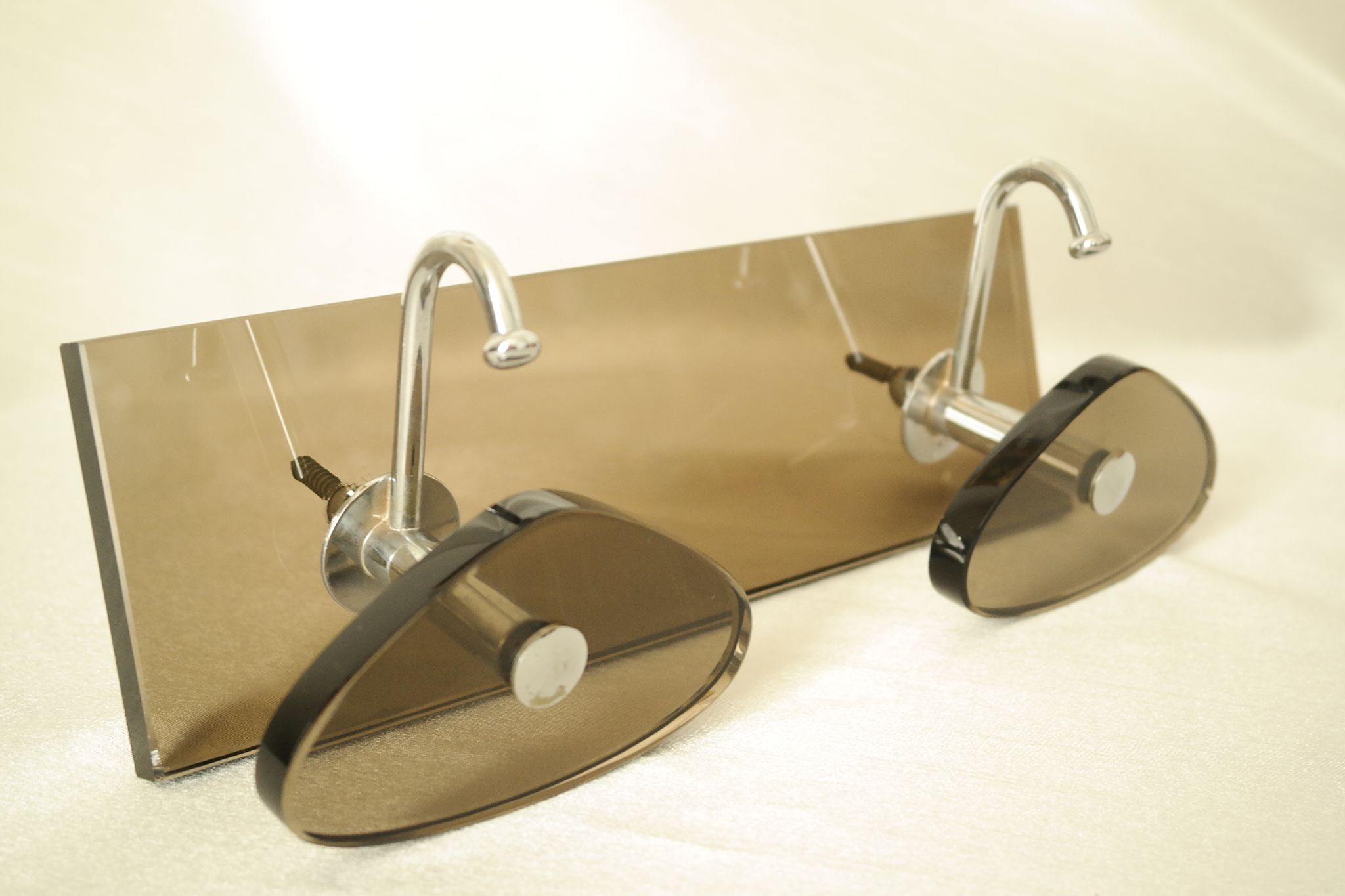 Brown smoked glass coat hook from the 1970s.