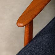 Pair Scandinavian Modern armchairs in teak and dark blue bouclé fabric