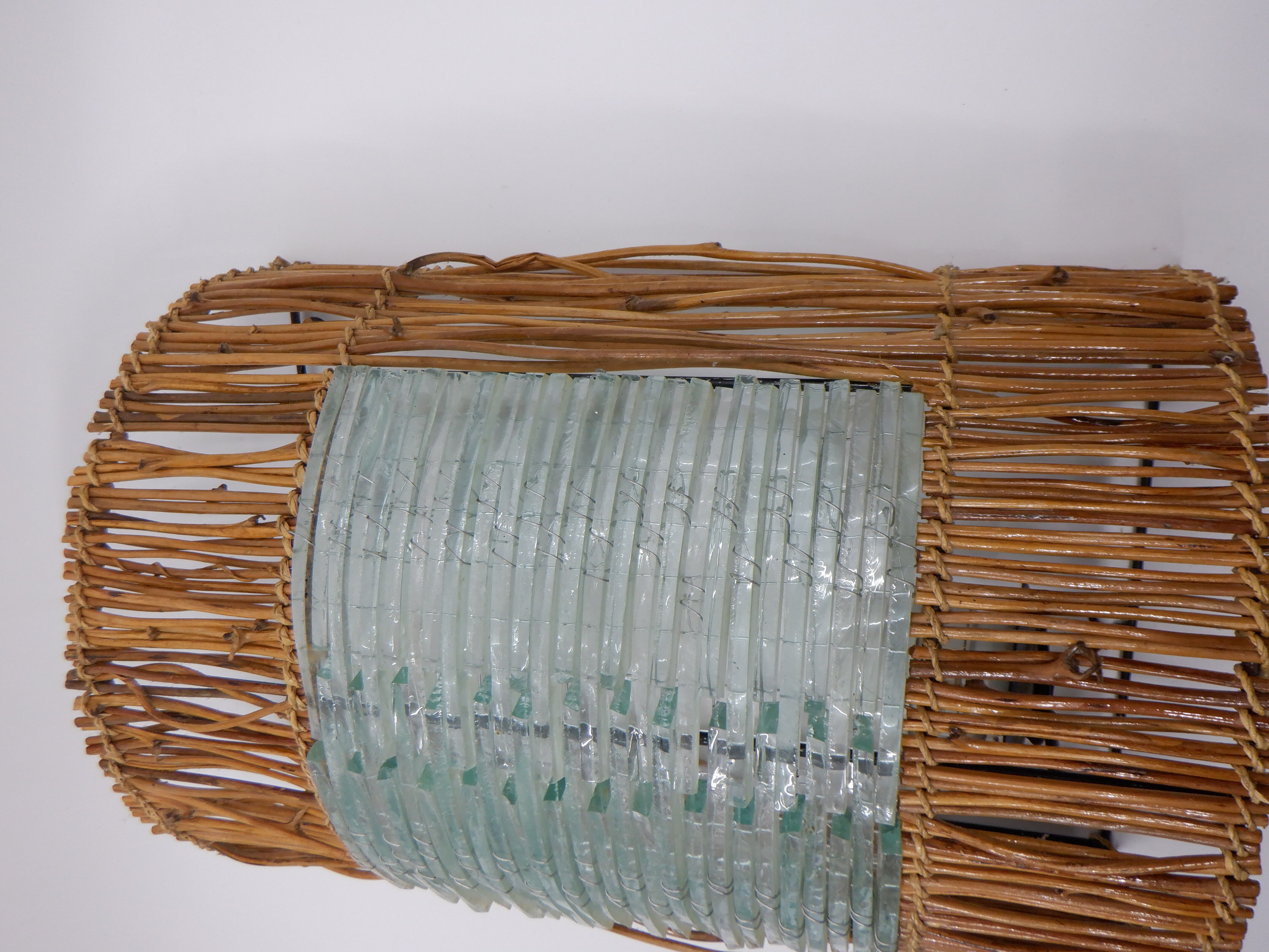 Glass and rattan sconce