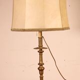bronze candlestick from the 17th century converted into a lamp with its lampshade