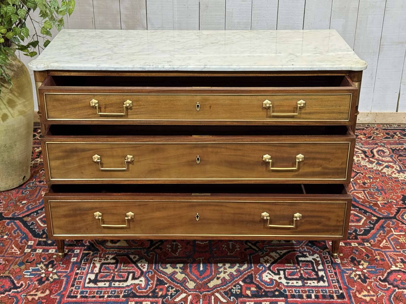 Louis XVI commode in mahogany with a marble top from the 1950s.