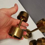 Three beautiful candle holders in solid brass, for block candles.