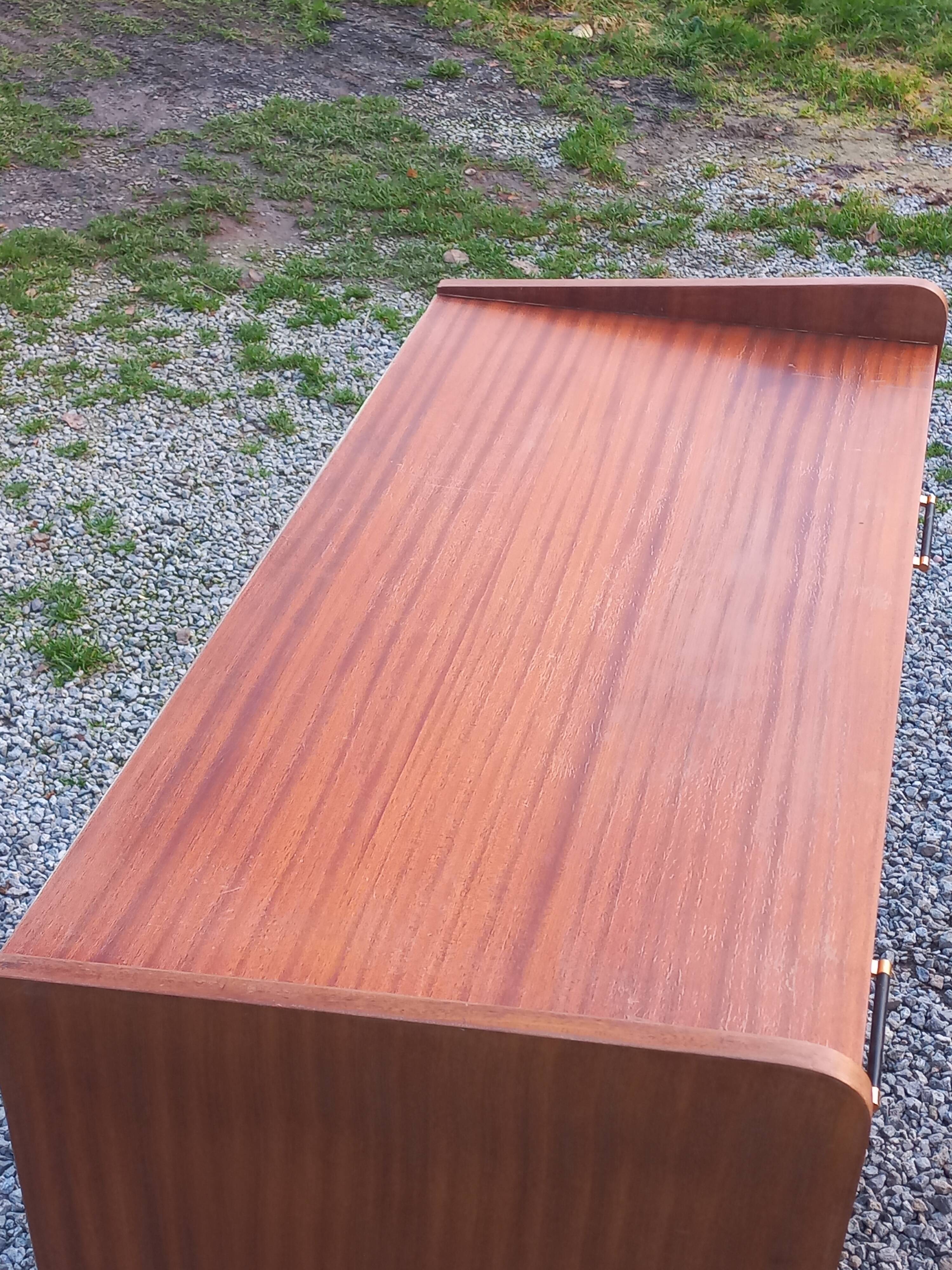 Vintage mahogany commode with metal tapered legs, 4 drawers, 1950s.