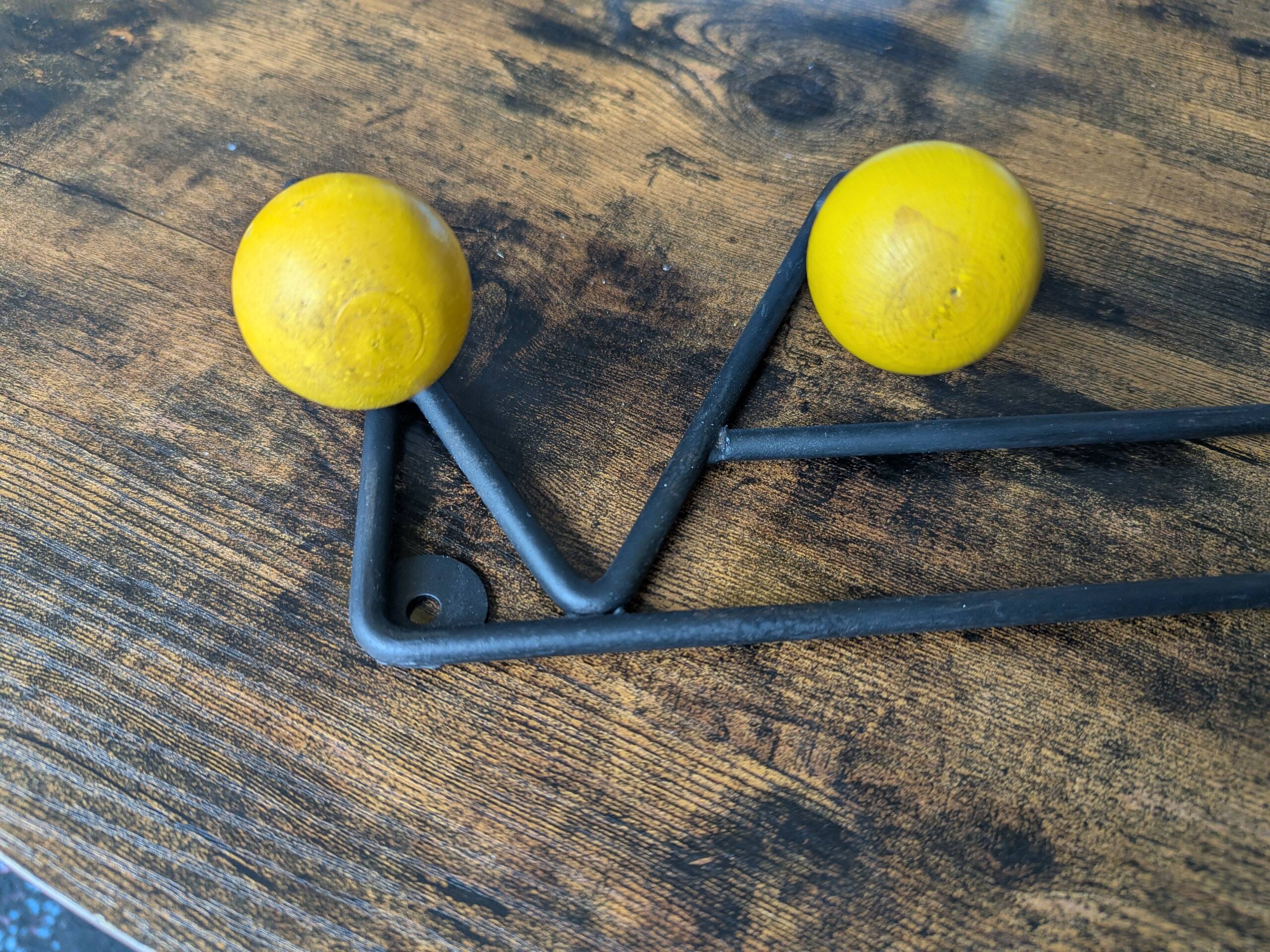 Vintage coat rack Roger Feraud with 4 yellow ball hooks.