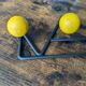 Vintage coat rack Roger Feraud with 4 yellow ball hooks.