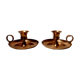 Pair of brass hand candlesticks