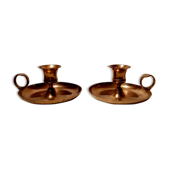 Pair of brass hand candlesticks