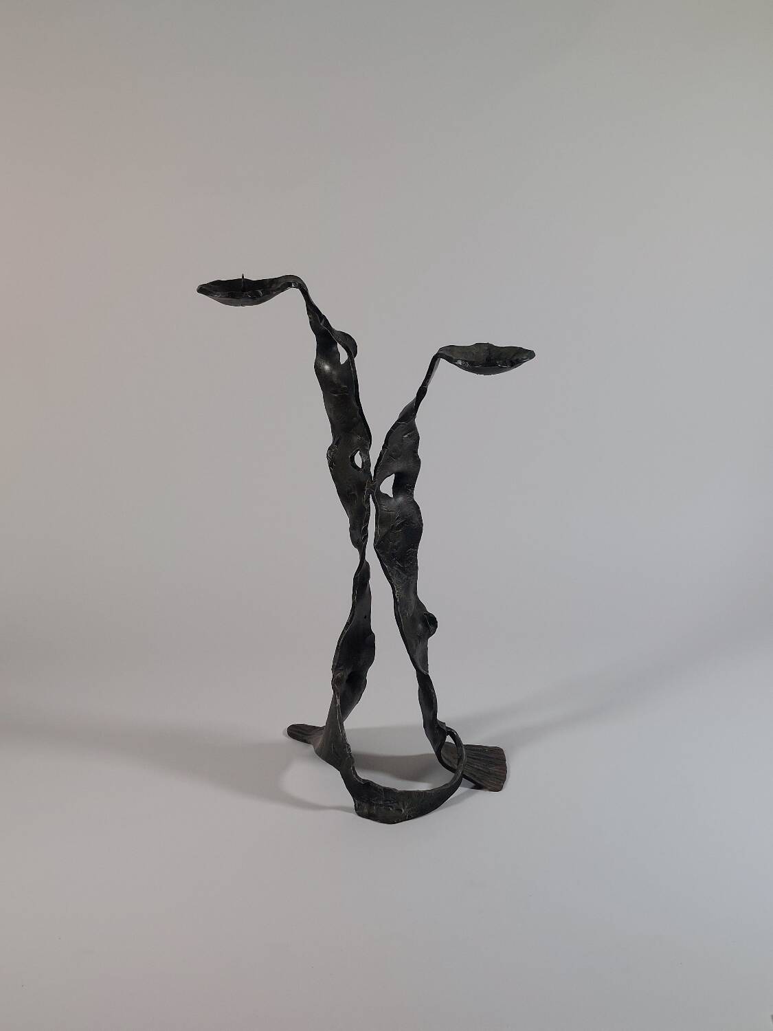 Sculptural brutalist floor candle holder made of hand-forged iron from the 1950s.