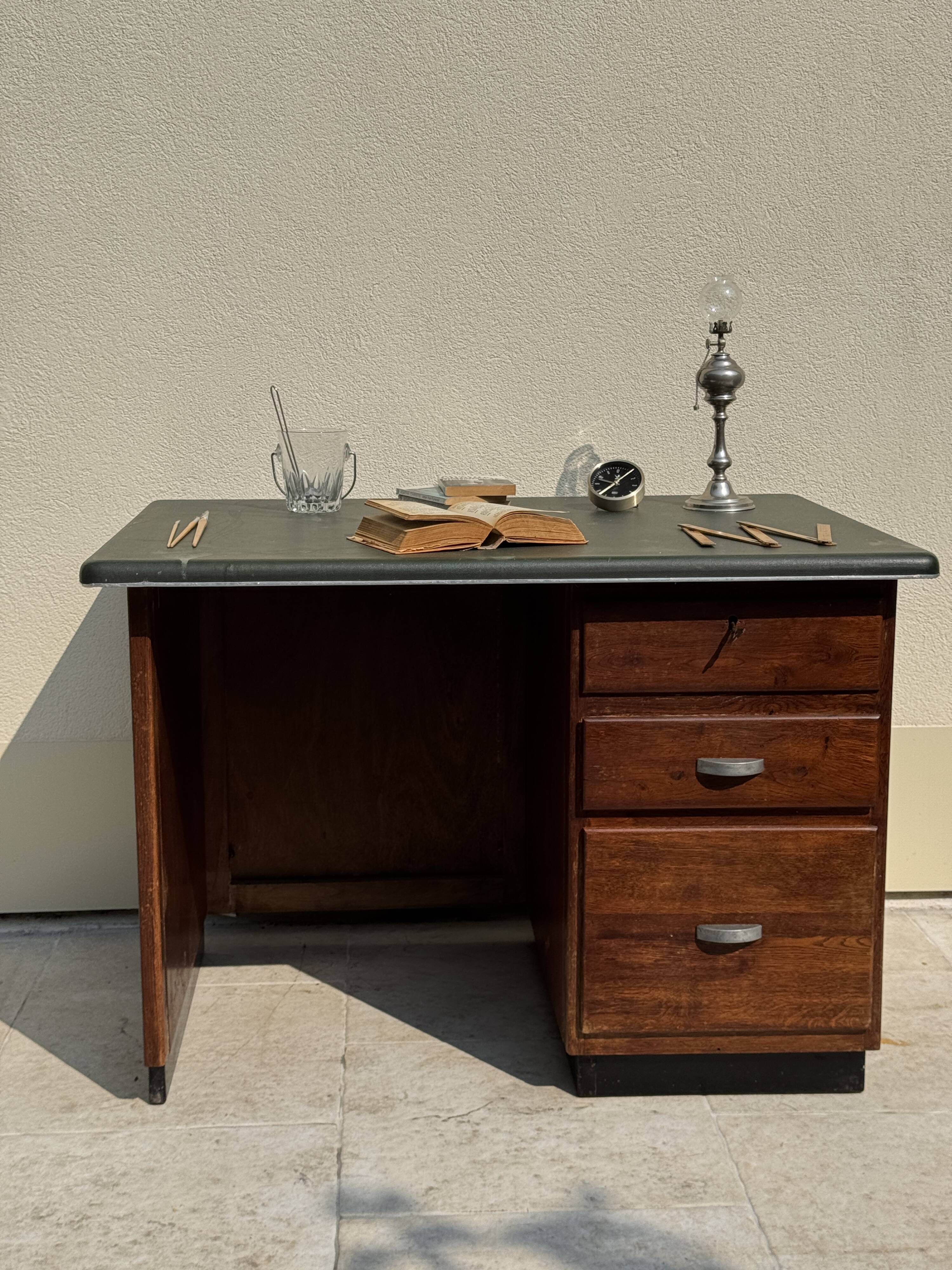 Modernist desk in wood and green moleskin upholstery