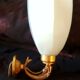 Golden brass wall light with glass tulip - dolphin pattern bathroom lamp