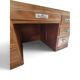 Large modernist minister's desk in solid lemon wood with 7 drawers.