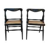 Pair of folding chairs in blackened wood and caning