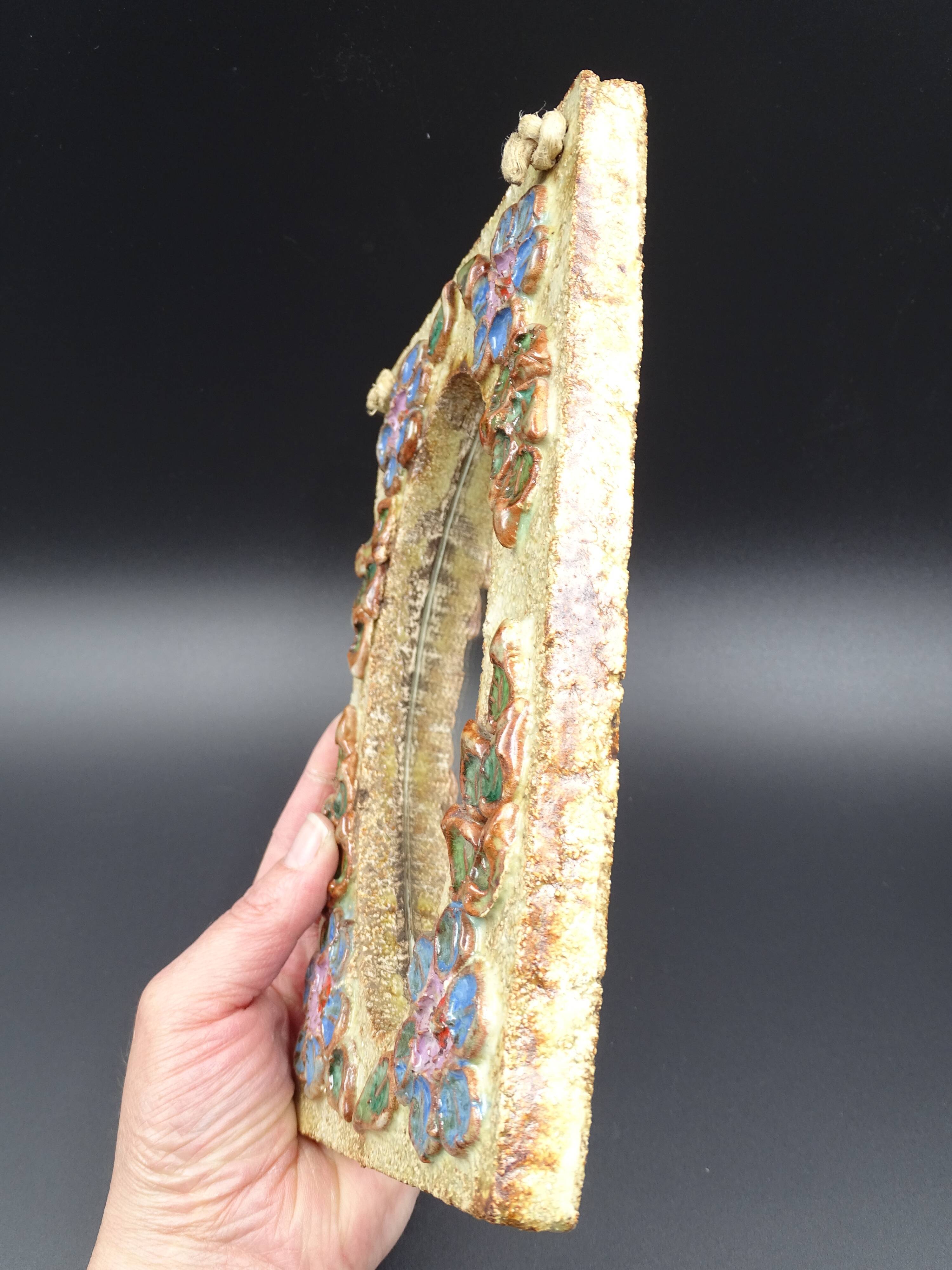 Flower-decorated sandstone mirror, circa 1970