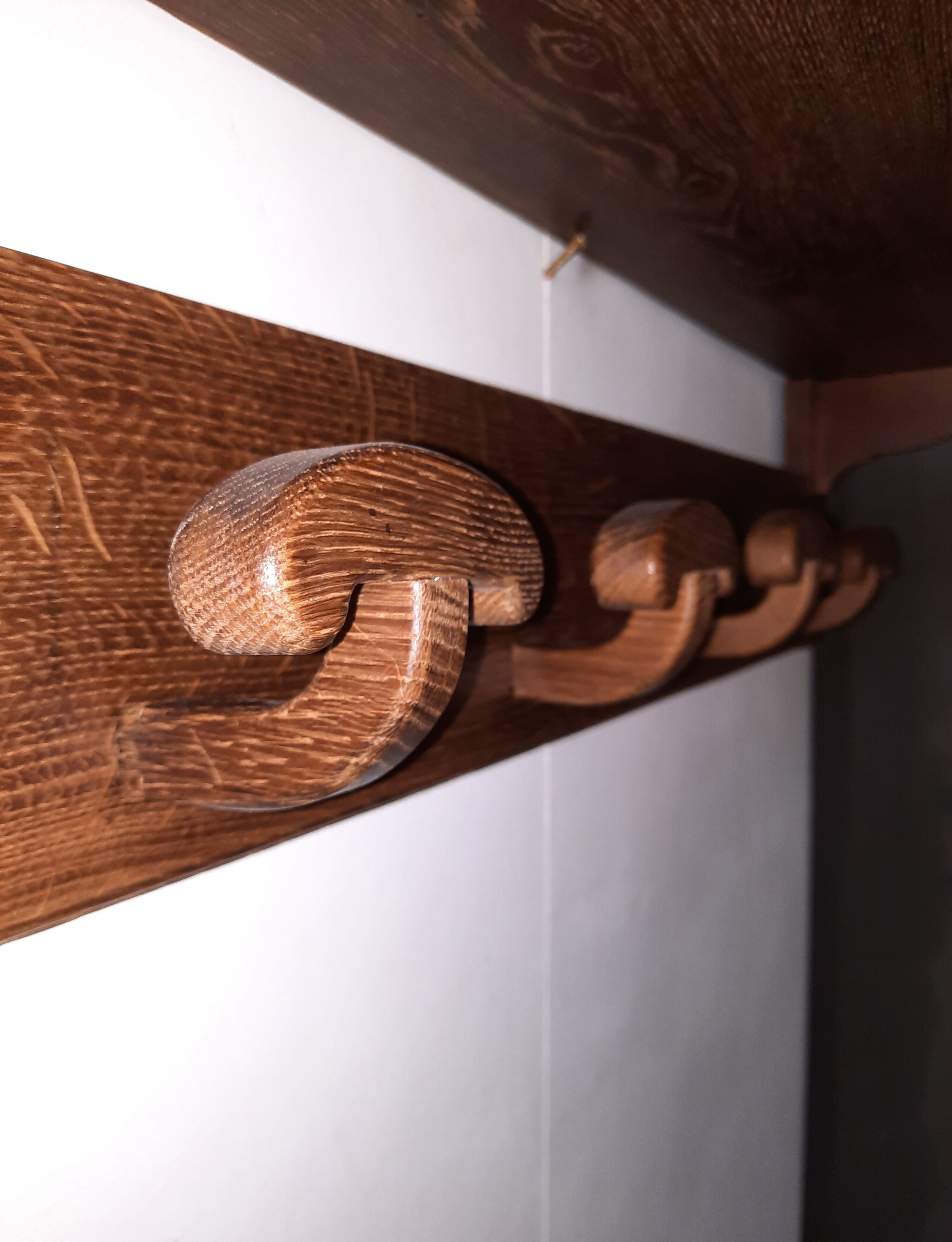 Wearing a brutalist style wooden wall coat
