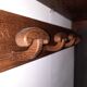 Wearing a brutalist style wooden wall coat