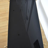 Black glass and brass coffee table in the 1960s