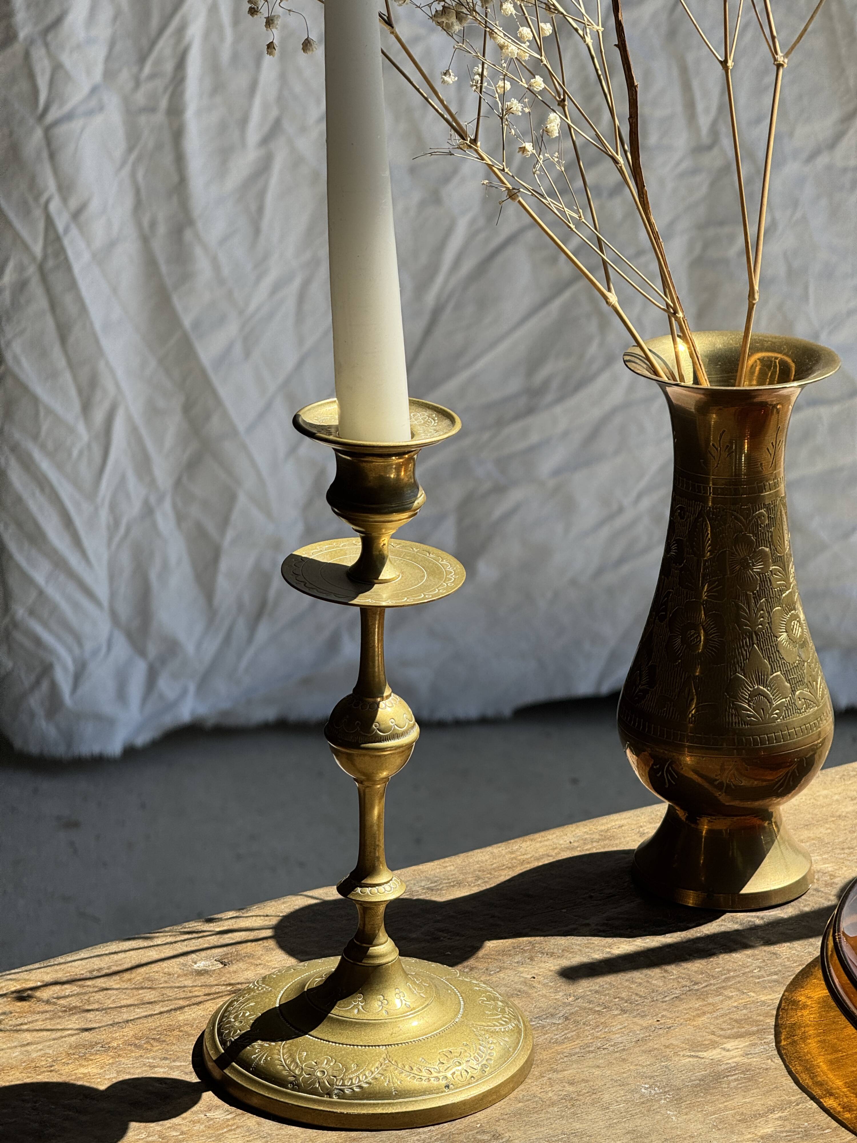 Pair of gilded candlesticks with engraved flower garland motifs H22