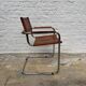 Vintage aluminum tube and tan leather armchair