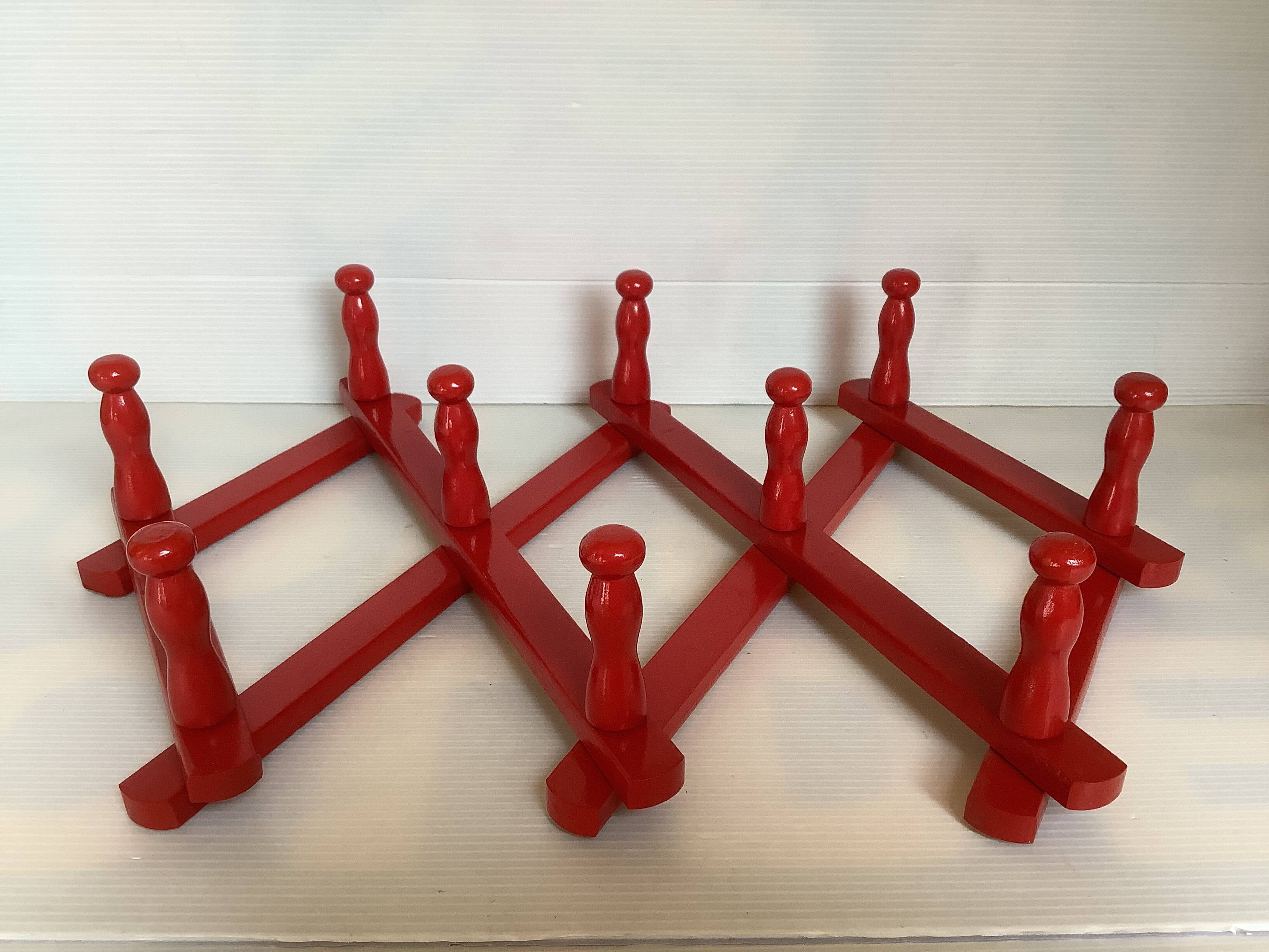 Red wood accordion coat rack