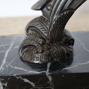 Pair of Art Deco bookends signed Frécourt, patinated metal & black marble