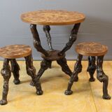 Pedestal table and its brutalist stools in vine stock around 1950