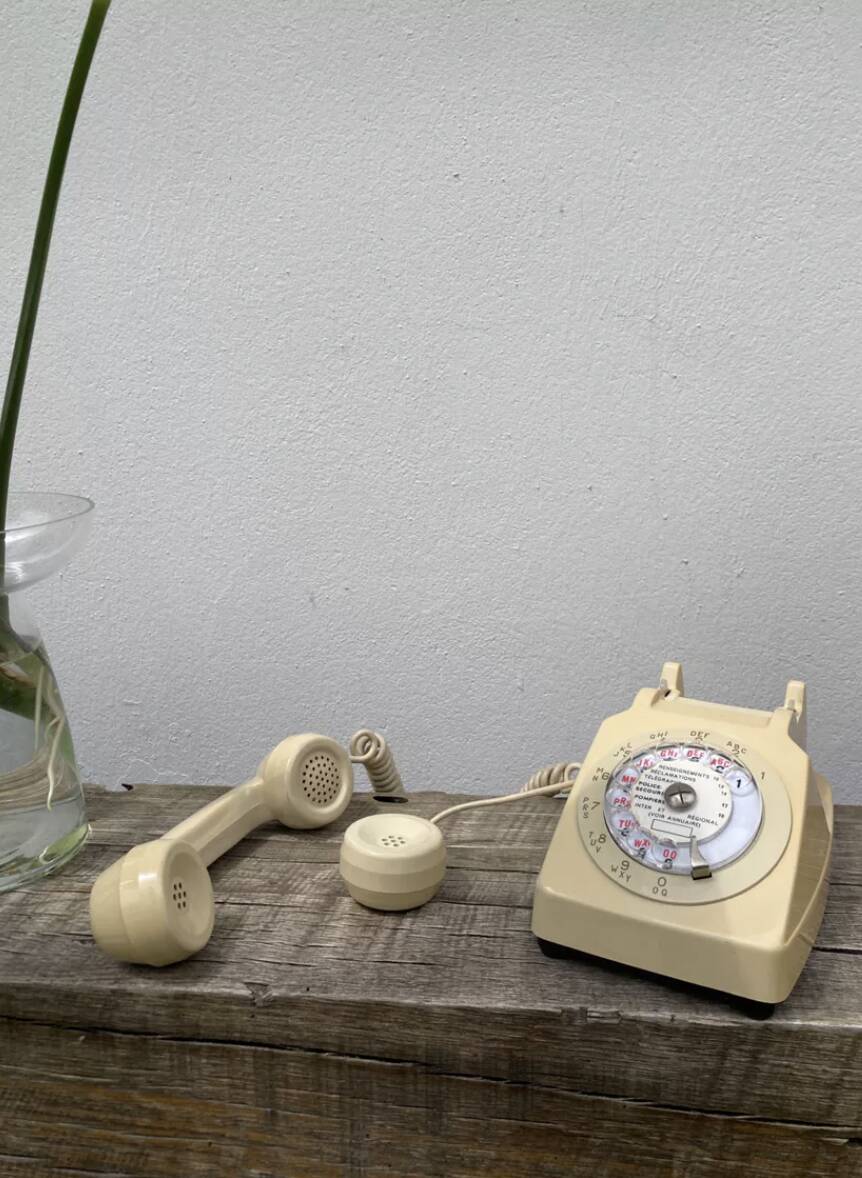 Vintage beige rotary telephone